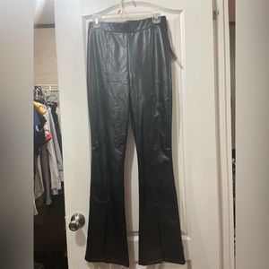 Black leather pants with bell bottoms splits